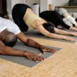 A yoga class on mats in a studio