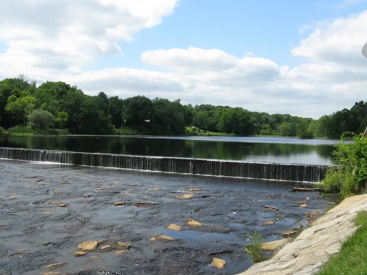 Water spilling over the dam at Lake Luisa in Milford