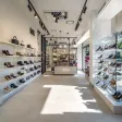 A retail showroom with lit display shelving